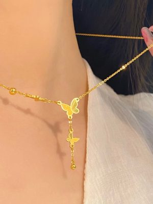 Gold Pearl and Bow Pendant Necklace