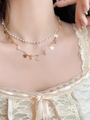 Gold Pearl and Bow Pendant Necklace